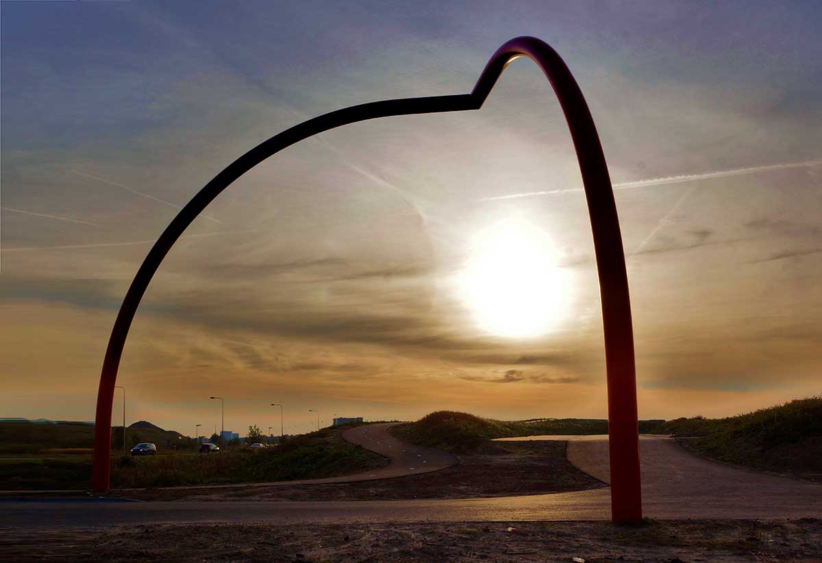 Gaia, steel gateway sculpture beside the roundabout at the entrance to the Buijtenland van Rhoon, forming a passage into the landscape.