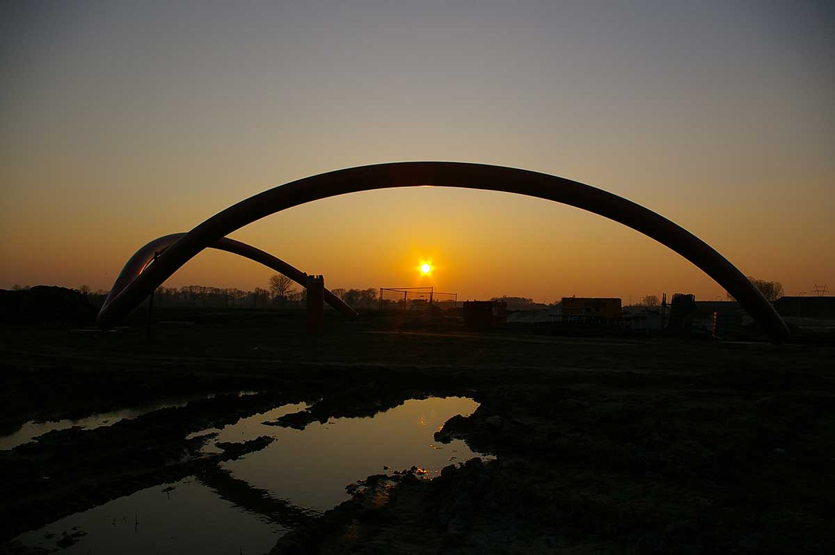 Reclining Gaia: the same sculpture lying horizontally in the landscape, suggesting the form of a woman giving birth.